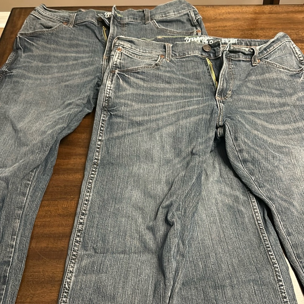 Two pairs of EUC Wrangler Retro Slim Straight jeans